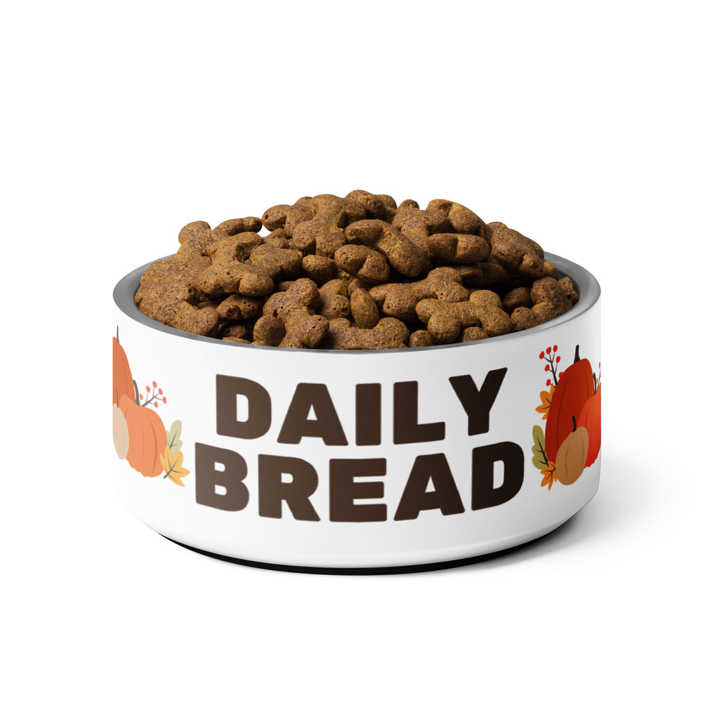 Daily Bread pet bowl with autumn leaves and pumpkin design, filled with dog kibble.