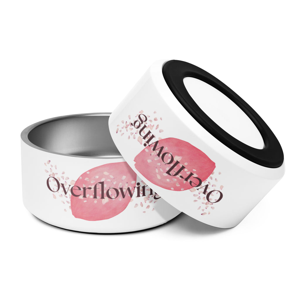White stainless steel pet bowls stacked, one showing “Overflowing” text with rose petal design.