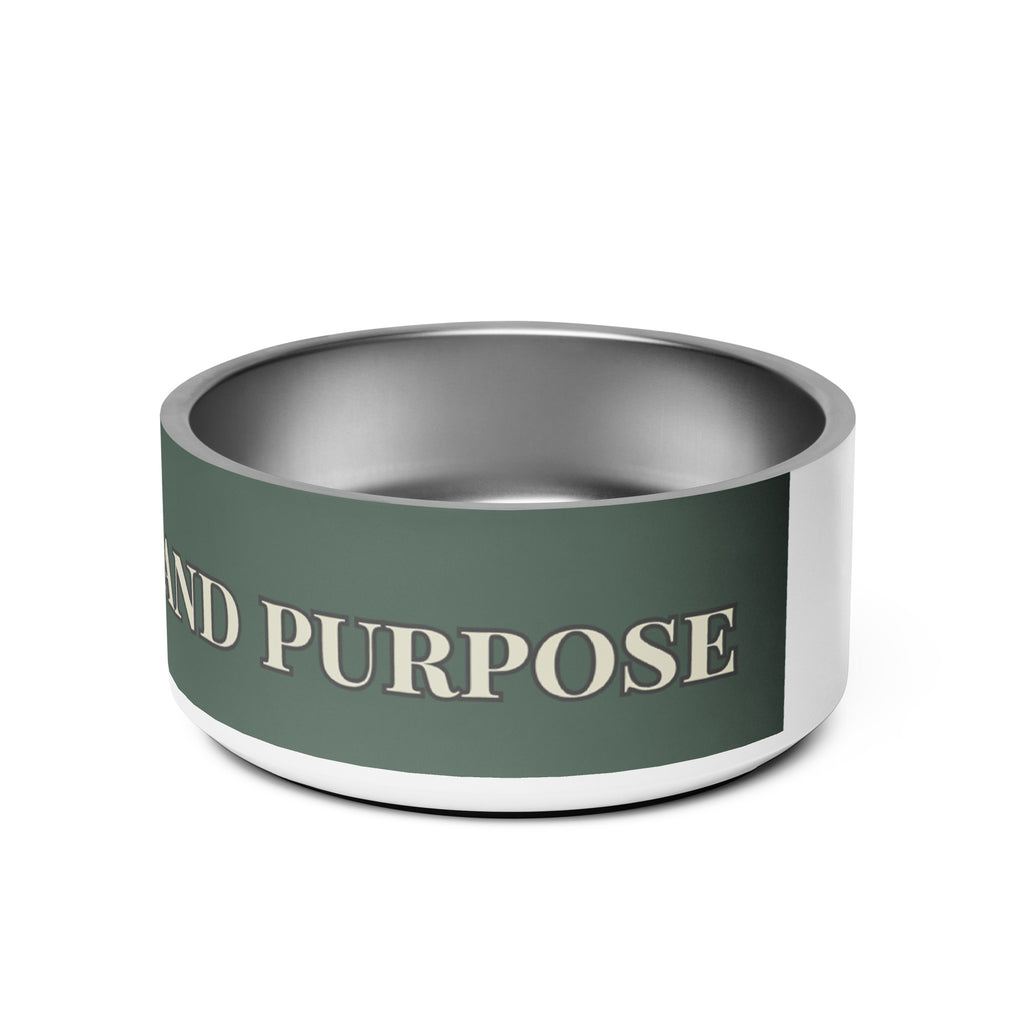 Close-up of side view white stainless steel pet bowl with the saying, " Fed with Love and Purpose". 