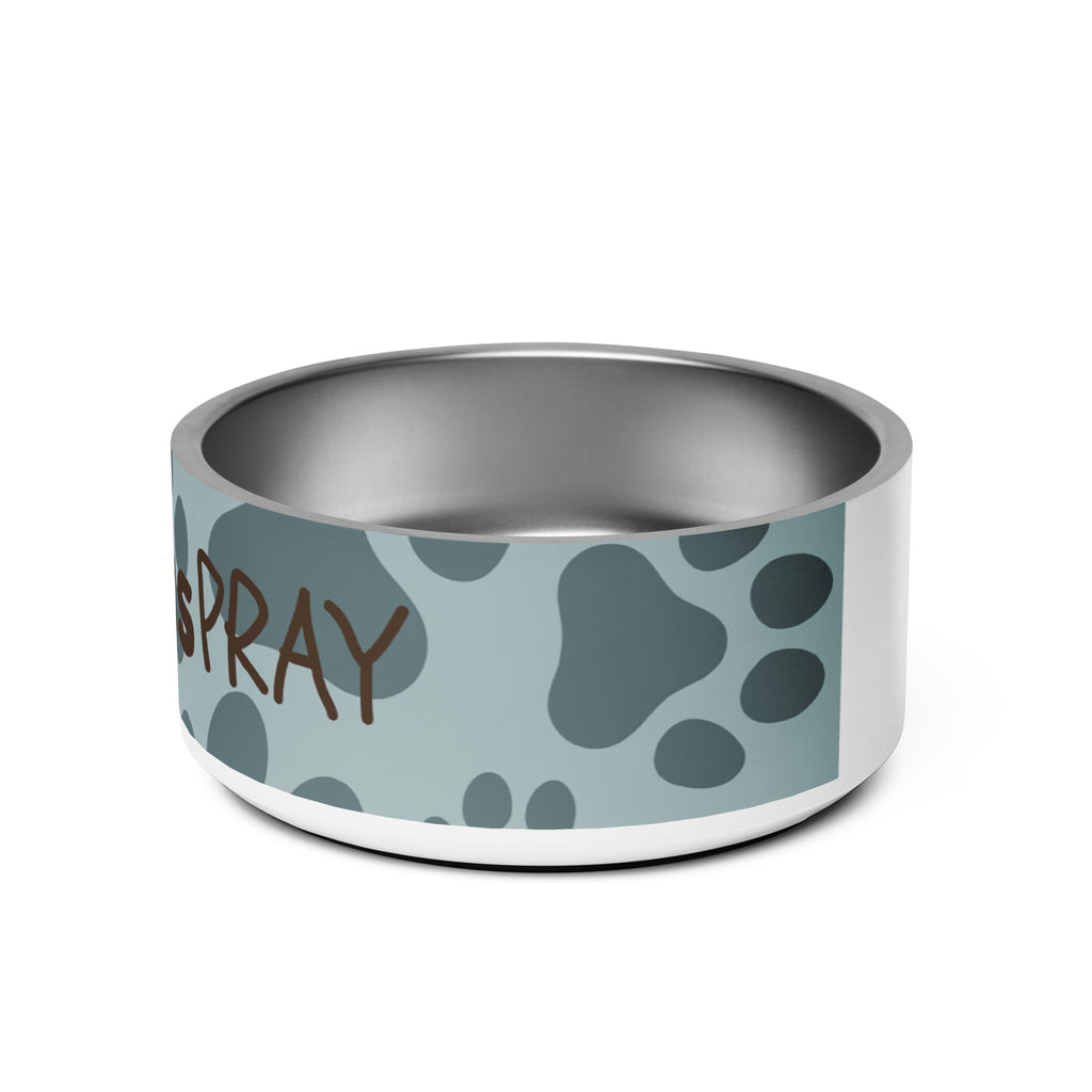 Side view of stainless steel pet bowl with soft blue background and scattered dark paw prints, featuring the text “Pawprints Pray” in brown bold and handwritten font.
