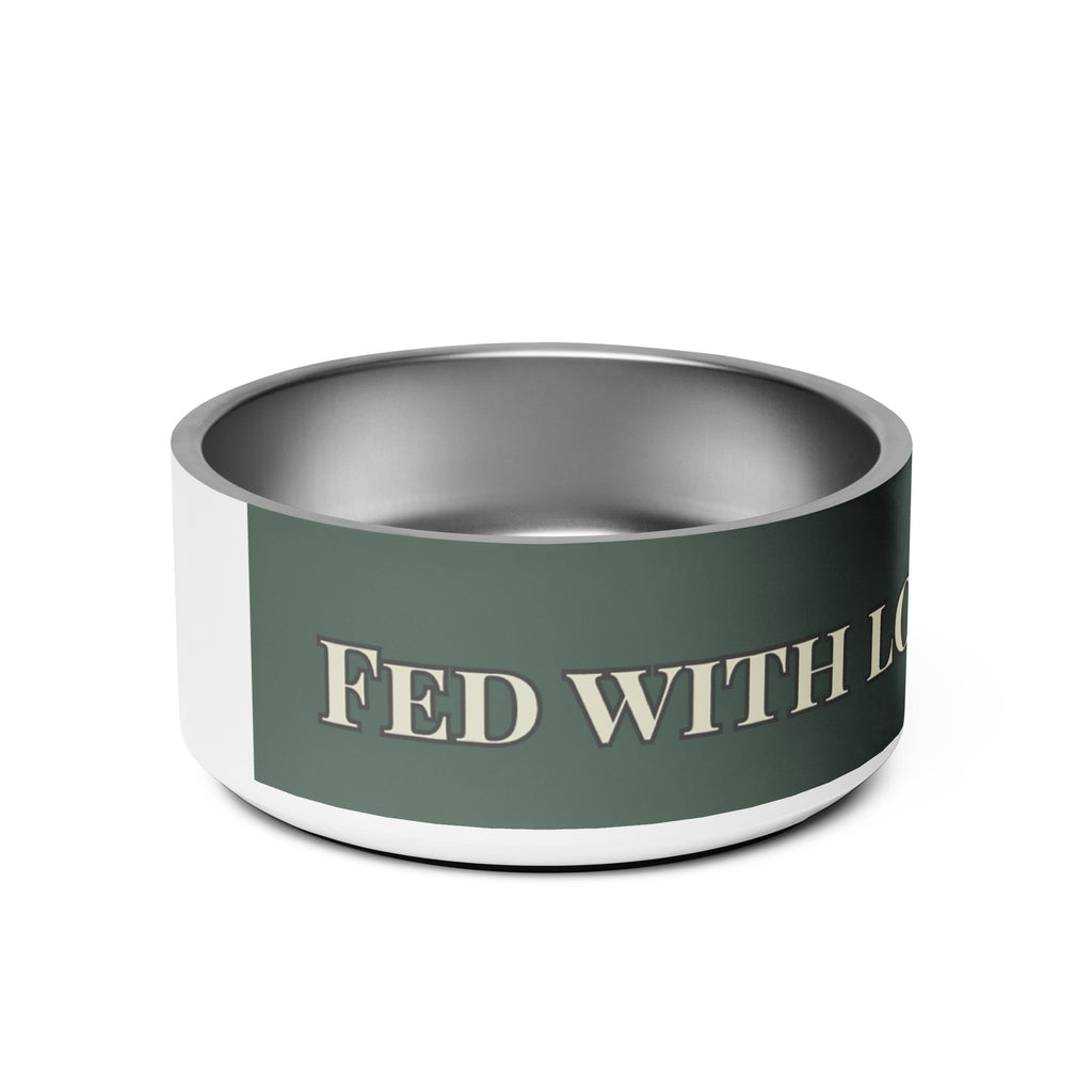 Close-up of side view white stainless steel pet bowl with the saying, " Fed with Love and Purpose". 