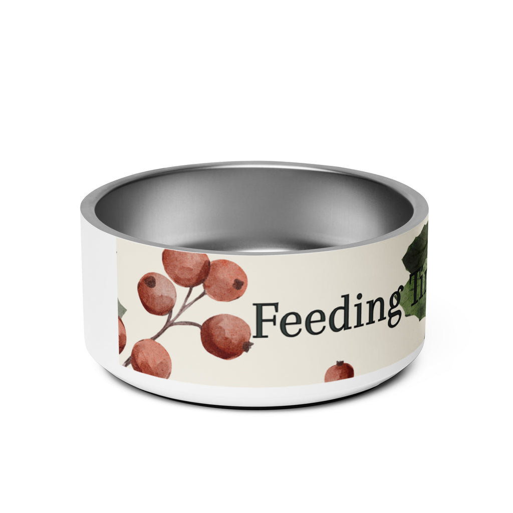Side view of stainless steel pet bowl with cream exterior and green leaf botanical pattern, text “Feeding Time, Faithful Time” around the rim, anti‑slip base visible