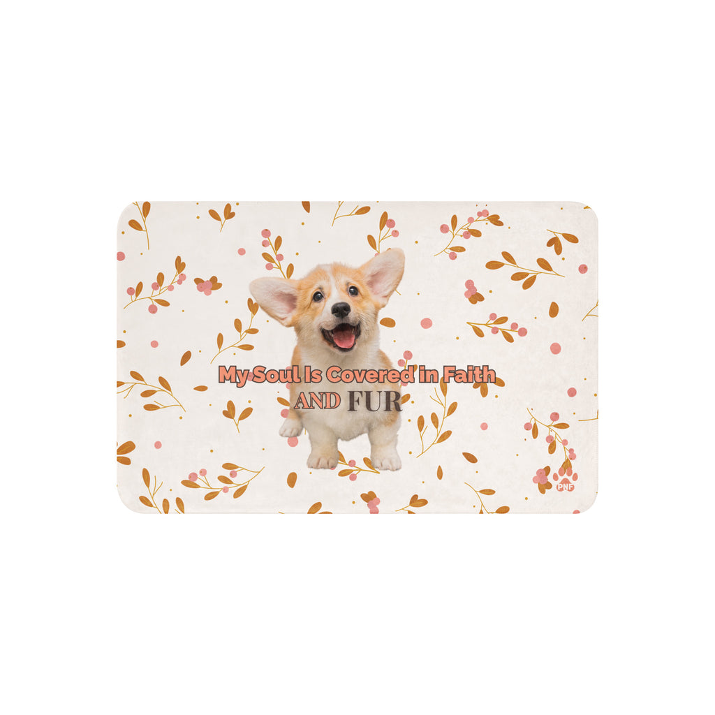 Flat view of floral sherpa blanket with a corgi with the words, " My Soul Is Covered in Faith and FUR". 