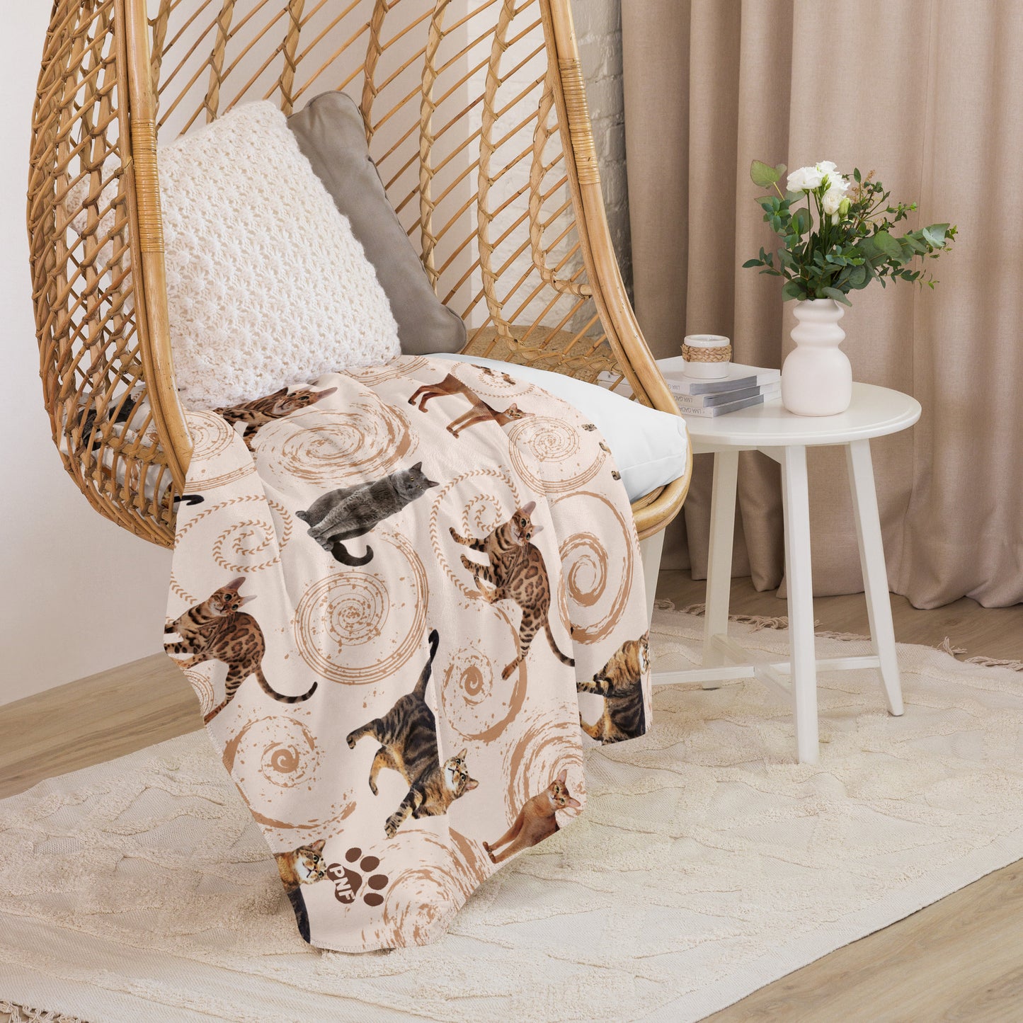 Cream sherpa blanket featuring illustrated cats in gray, brown, and tabby patterns surrounded by spiral swirls, luxury cat lover home décor by Pets N’ Faith.