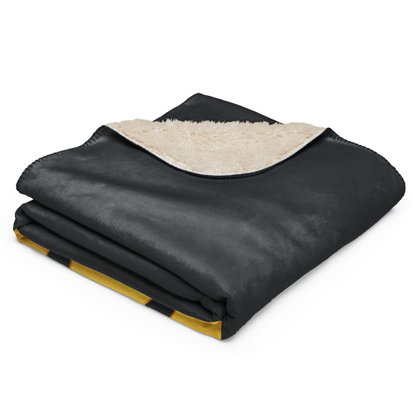 Folded black blanket with beige interior on a white background
