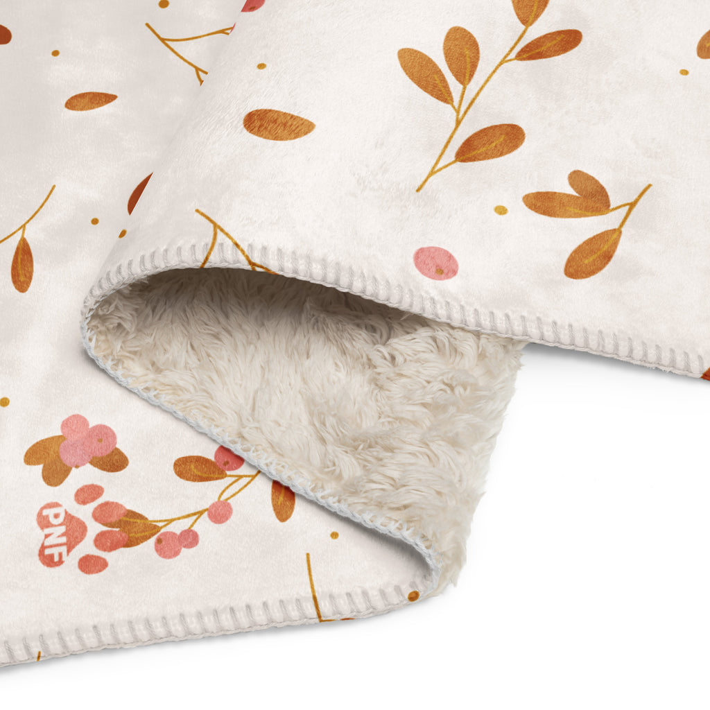  Flat view of floral sherpa blanket with a corgi with the words, " My Soul Is Covered in Faith and FUR". 