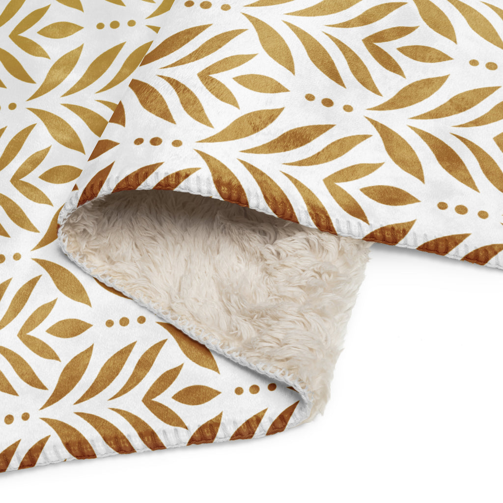 Sherpa blanket featuring a gold leaf pattern and “Paws and Praise” lettering in warm tones, a faith-inspired design that symbolizes gratitude, comfort, and the love between pets and their owners.
