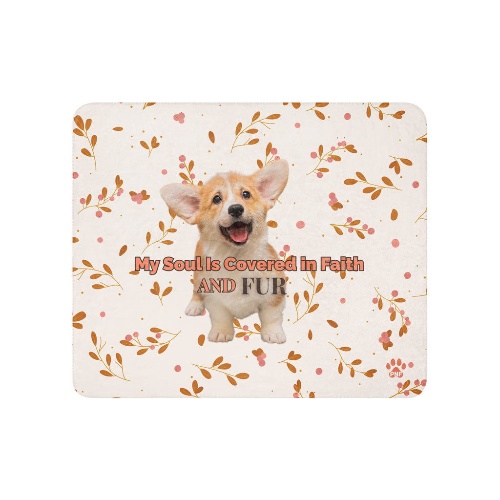Flat view of floral sherpa blanket with a corgi with the words, " My Soul Is Covered in Faith and FUR". 