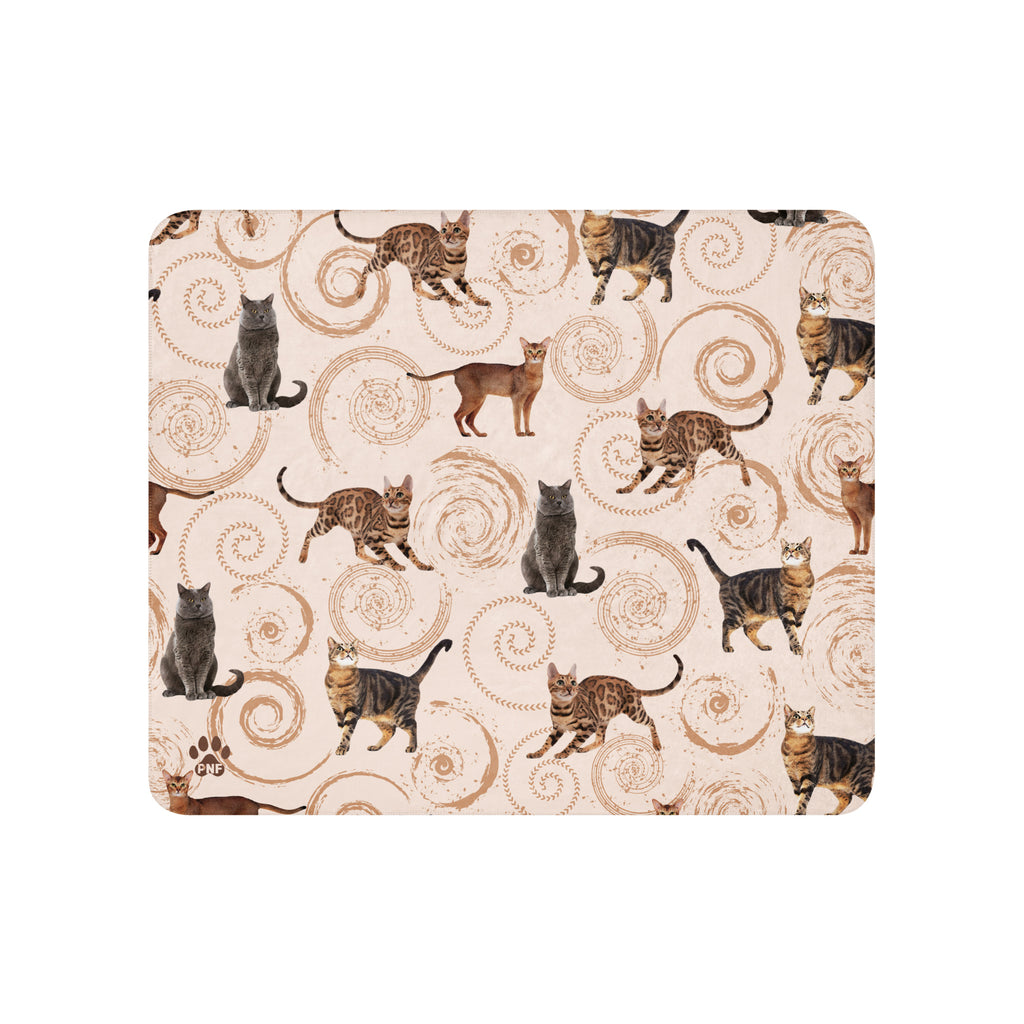 Cream sherpa blanket featuring illustrated cats in gray, brown, and tabby patterns surrounded by spiral swirls, luxury cat lover home décor by Pets N’ Faith.