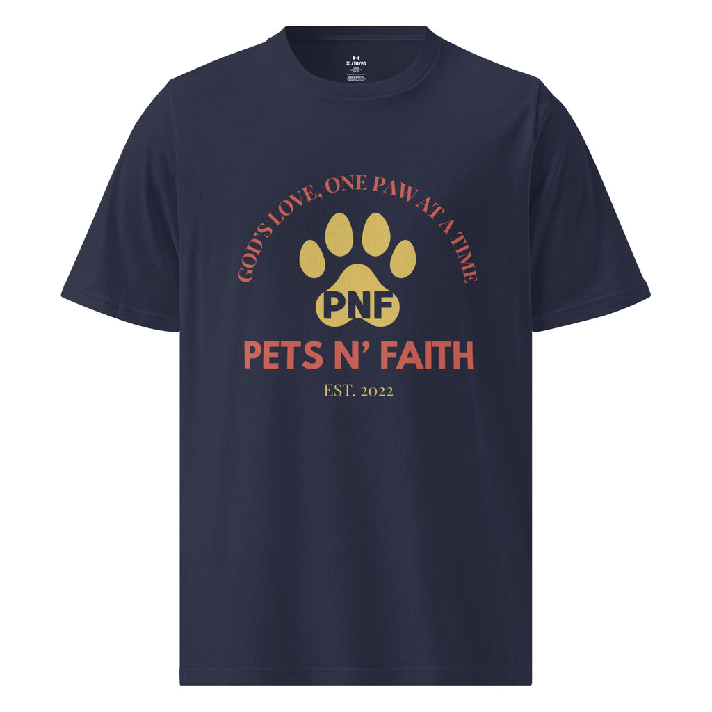 Front view of a navy blue  Under Armour Pets N’ Faith Performance T-Shirt with “God's Love, One Paw at a Time” design. A gold Pets N' Faith paw print with the words, " Pets N' Faith Est. 2022" in red text.  