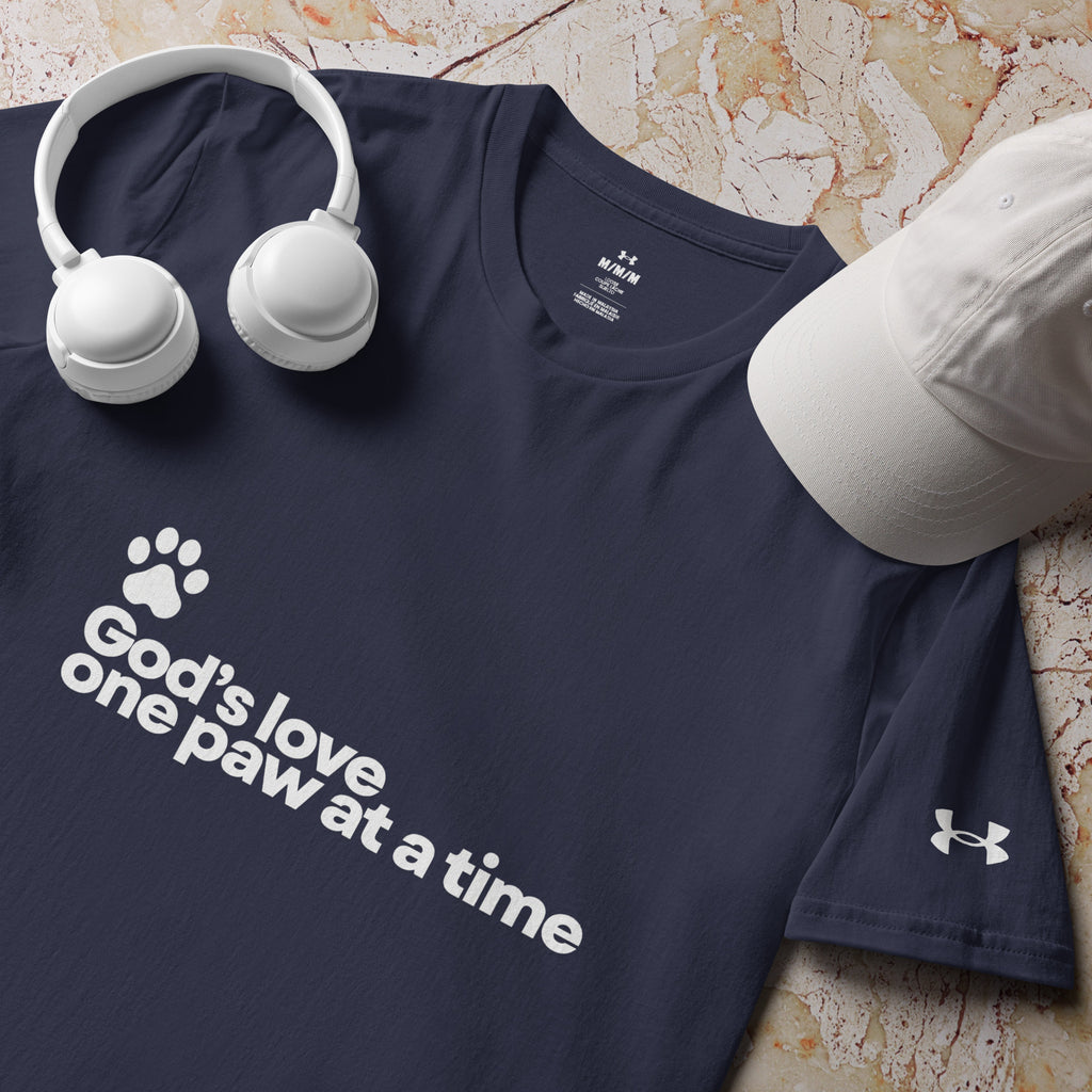 Navy blue Under Armour shirt with the phrase, " God's Love One Paw At A Time" with a white pawprint graphic. 