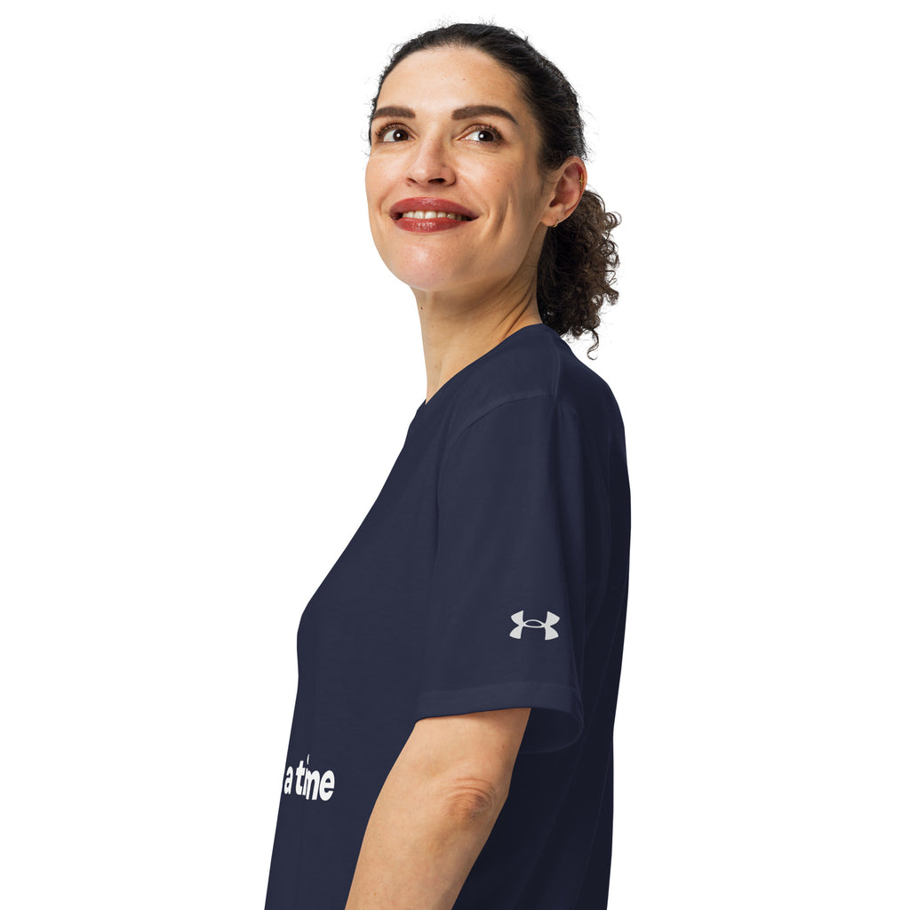 Navy blue Under Armour shirt with the phrase, " God's Love One Paw At A Time" with a white pawprint graphic. 