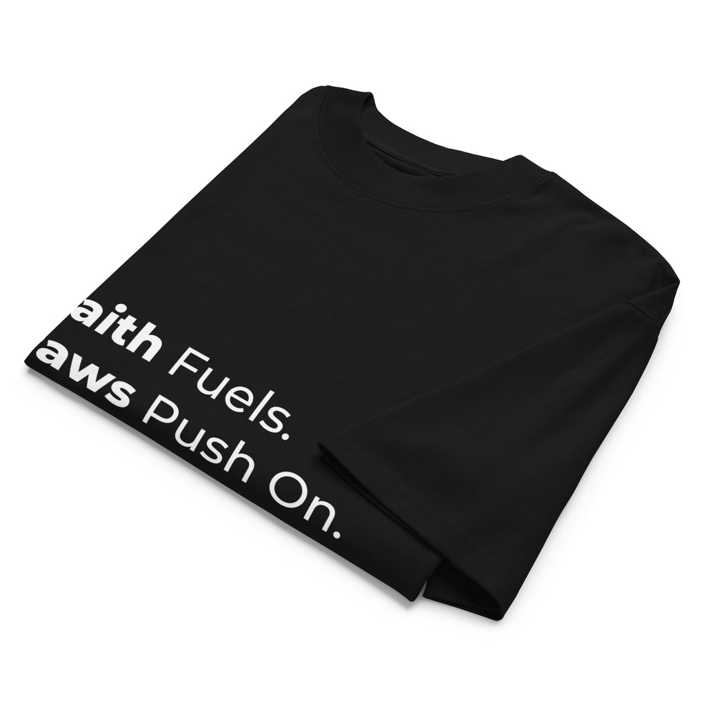 Folded black oversized Pets N Faith t-shirt with faith-inspired slogan partly visible
