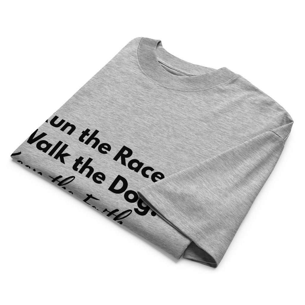 Folded heather gray oversized Pets N Faith t-shirt with faith-inspired slogan partly visible