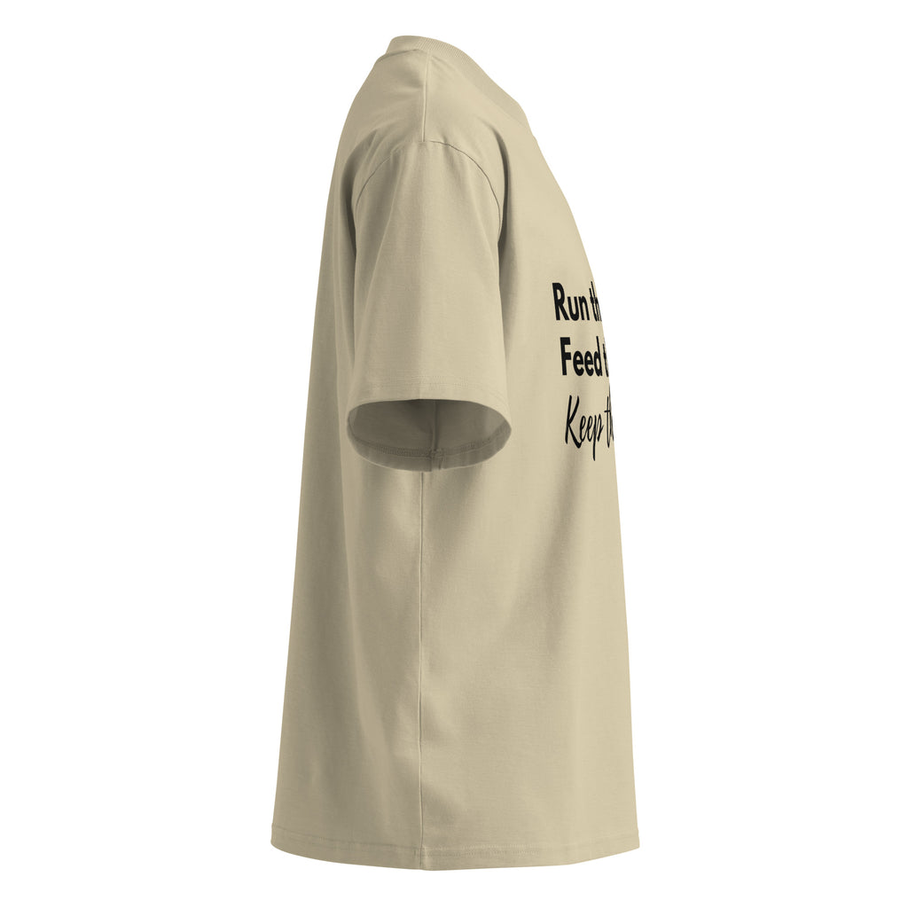 Side profile of khaki oversized Pets N Faith t-shirt showing relaxed oversized fit and short sleeves