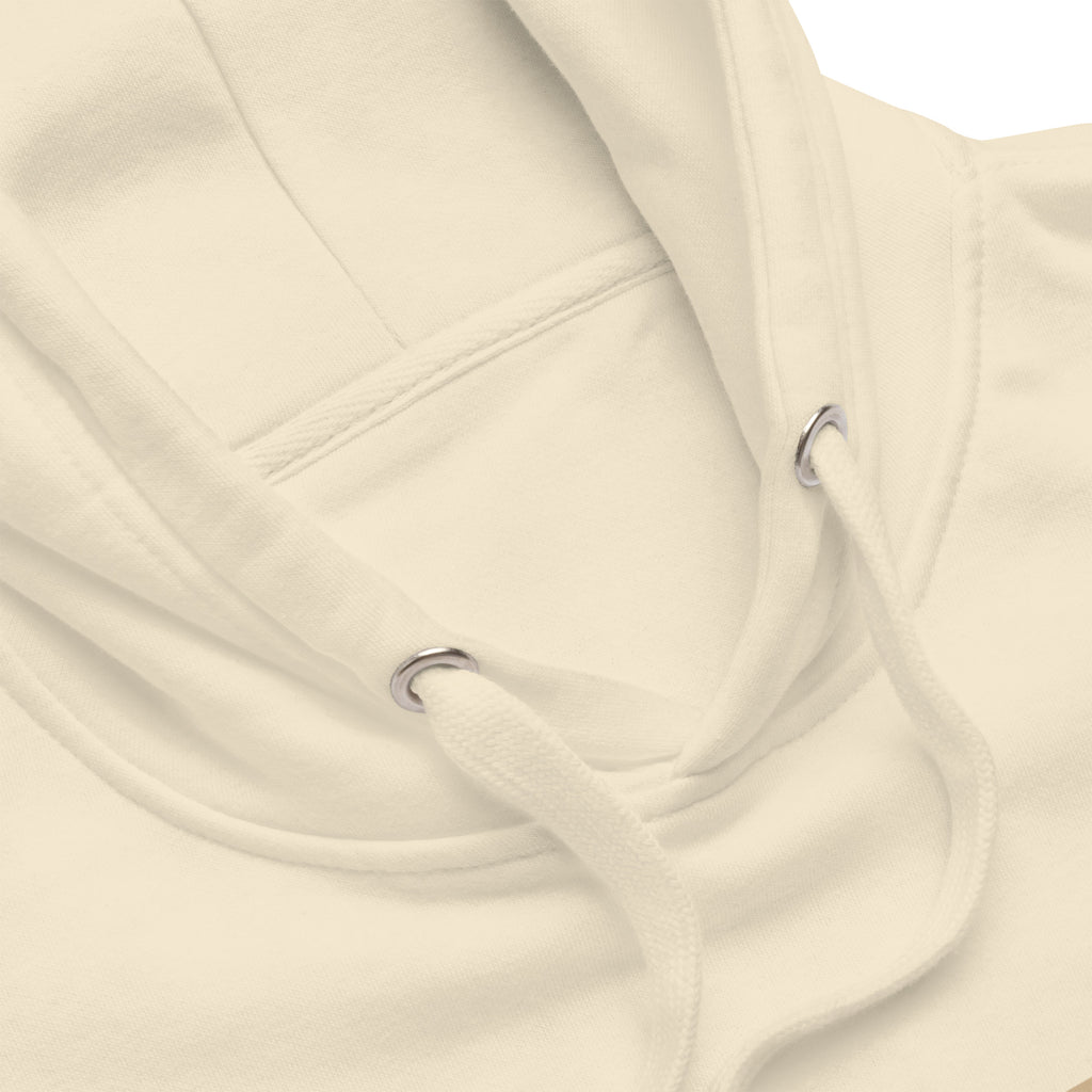 Close-up of cream-colored Unisex hoodie neckline with matching drawstrings and metal grommets