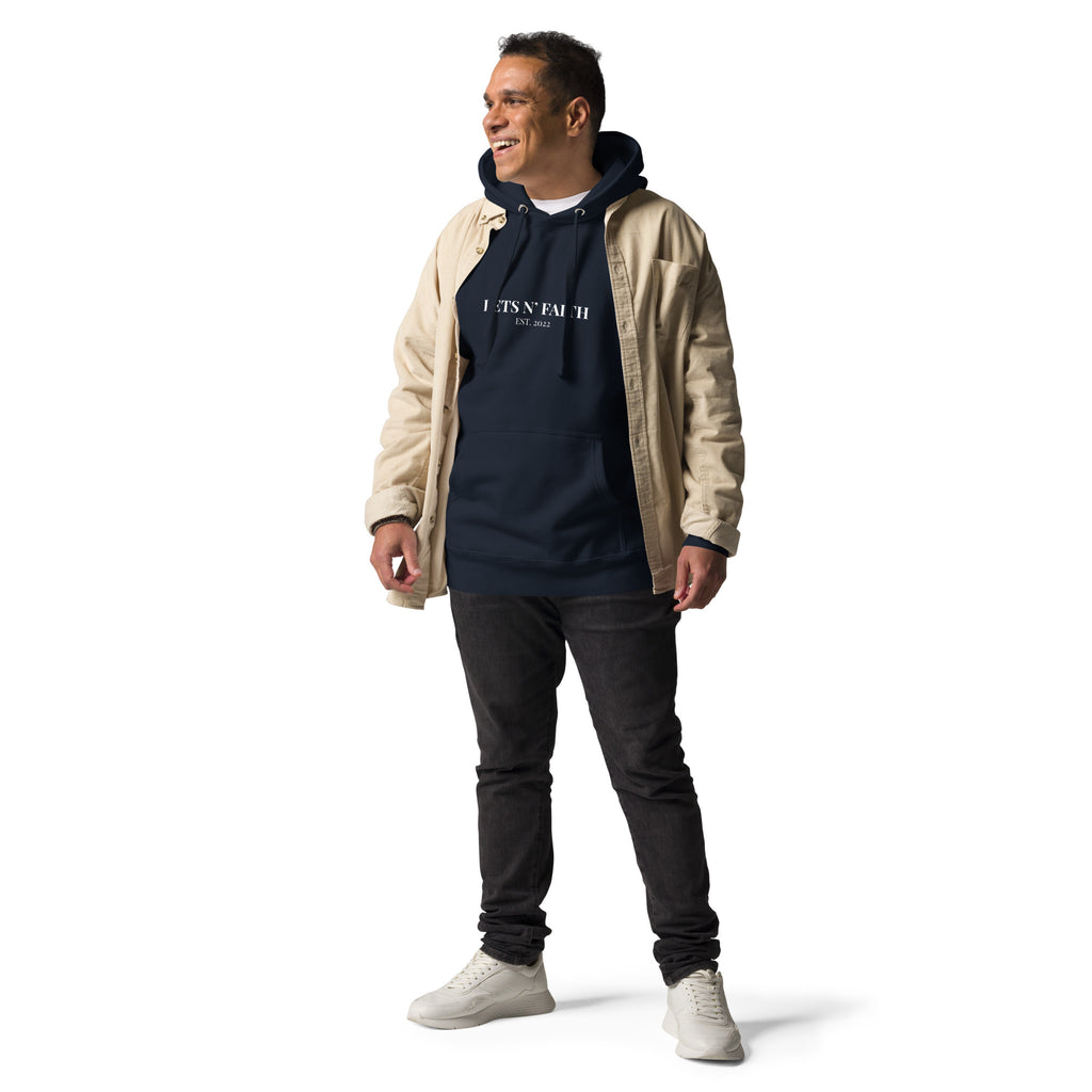 Man wearing navy blue Unisex Pets N’ Faith Est. 2022 hoodie with khaki jacket 