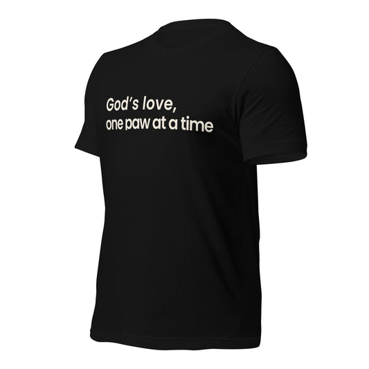 Black t-shirt with white text 'God's love, one paw at a time' on a white background