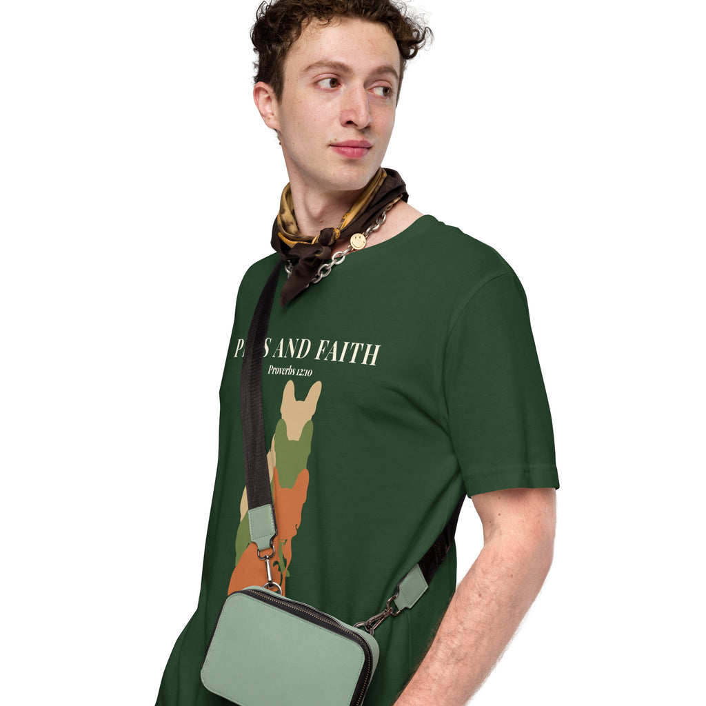 Man with messenger back wearing  Forest green Pets N Faith unisex dog t-shirt with Proverbs 12:10 scripture and layered dog silhouette graphic.