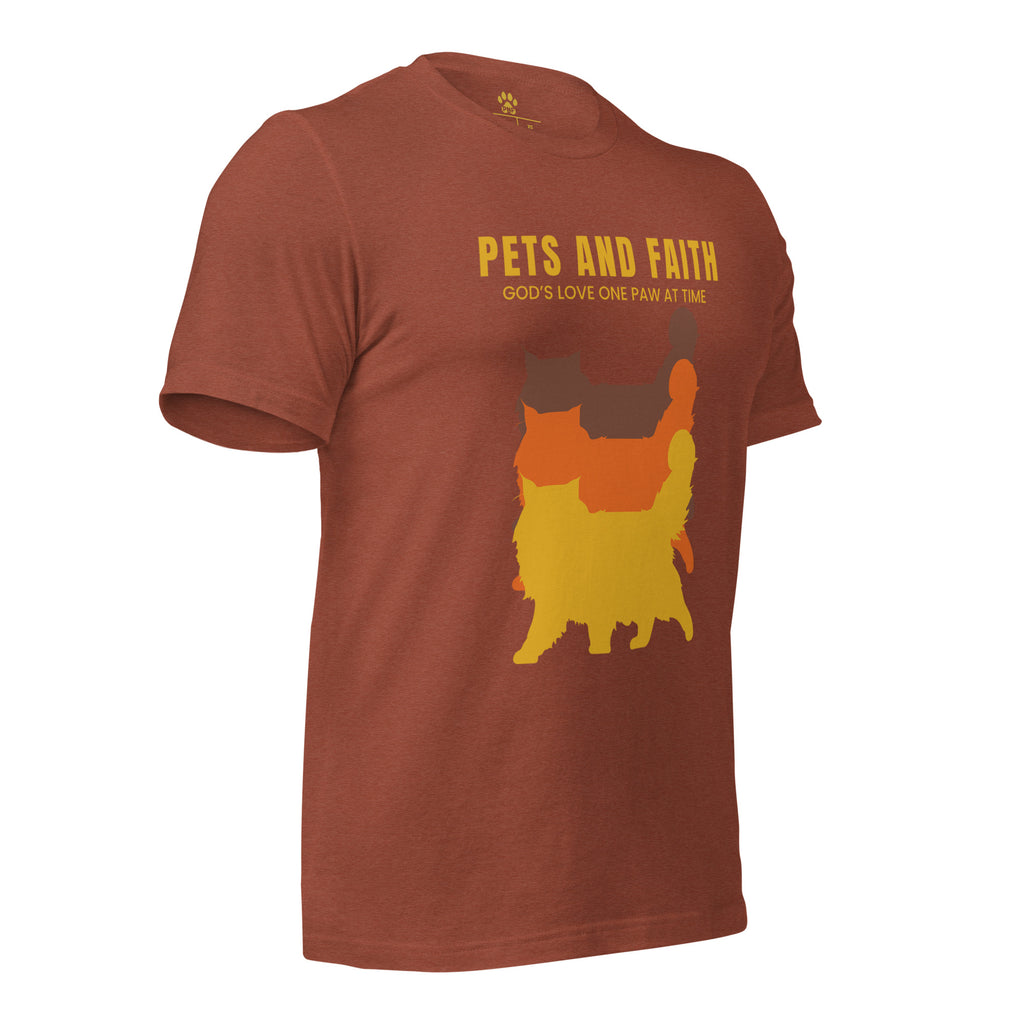 Side view of autumn Pets N Faith unisex cat t-shirt with ‘God’s Love One Paw at a Time’ text and layered cat silhouette design