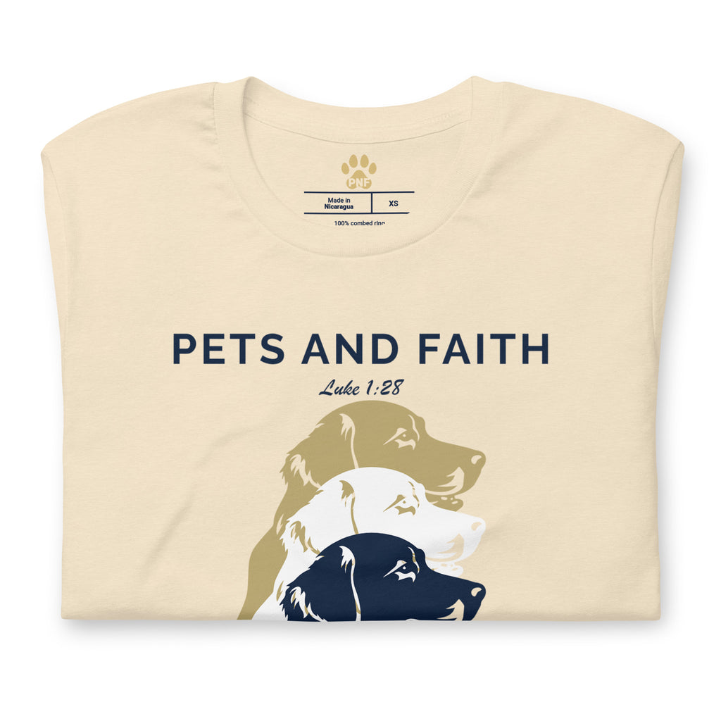 Folded view of Heather Natural Pets N Faith unisex dog t-shirt with Luke 1:28 scripture and layered dog silhouette design.