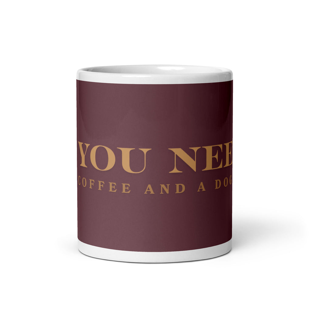 An white glossy mug with the graphic stating, " All You Need is Coffee and A Dog" 