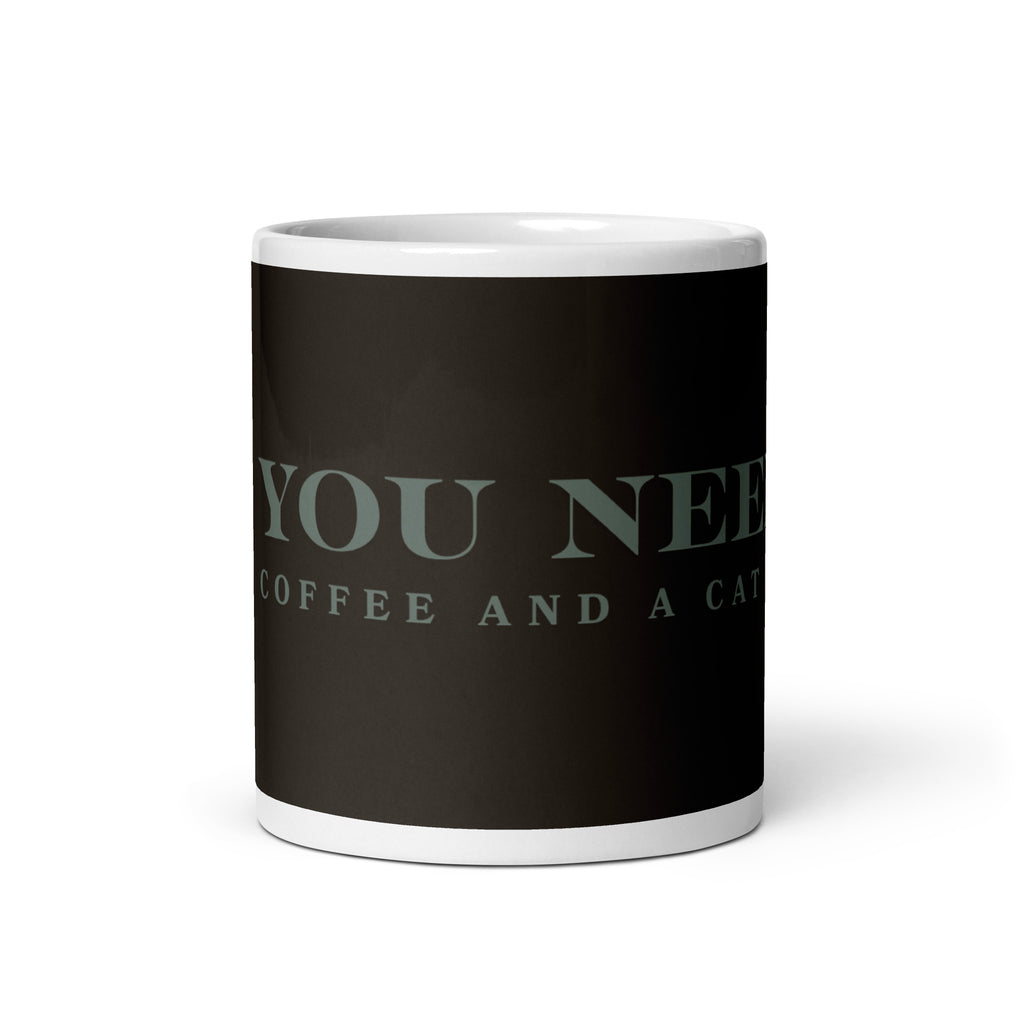 A white glossy mug with the graphic stating, " All You Need is Coffee and A Cat" 