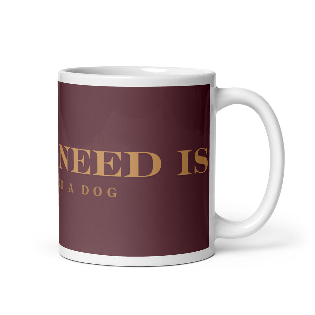 An white glossy mug with the graphic stating, " All You Need is Coffee and A Dog" 