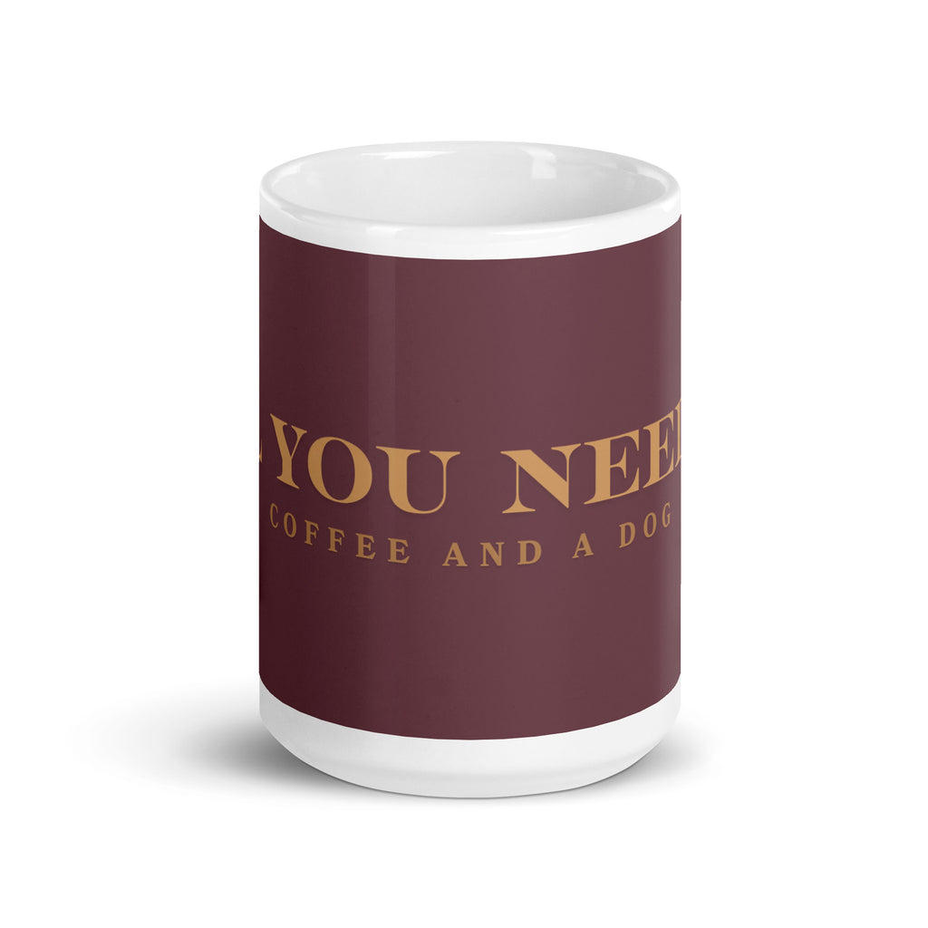 An white glossy mug with the graphic stating, " All You Need is Coffee and A Dog" 