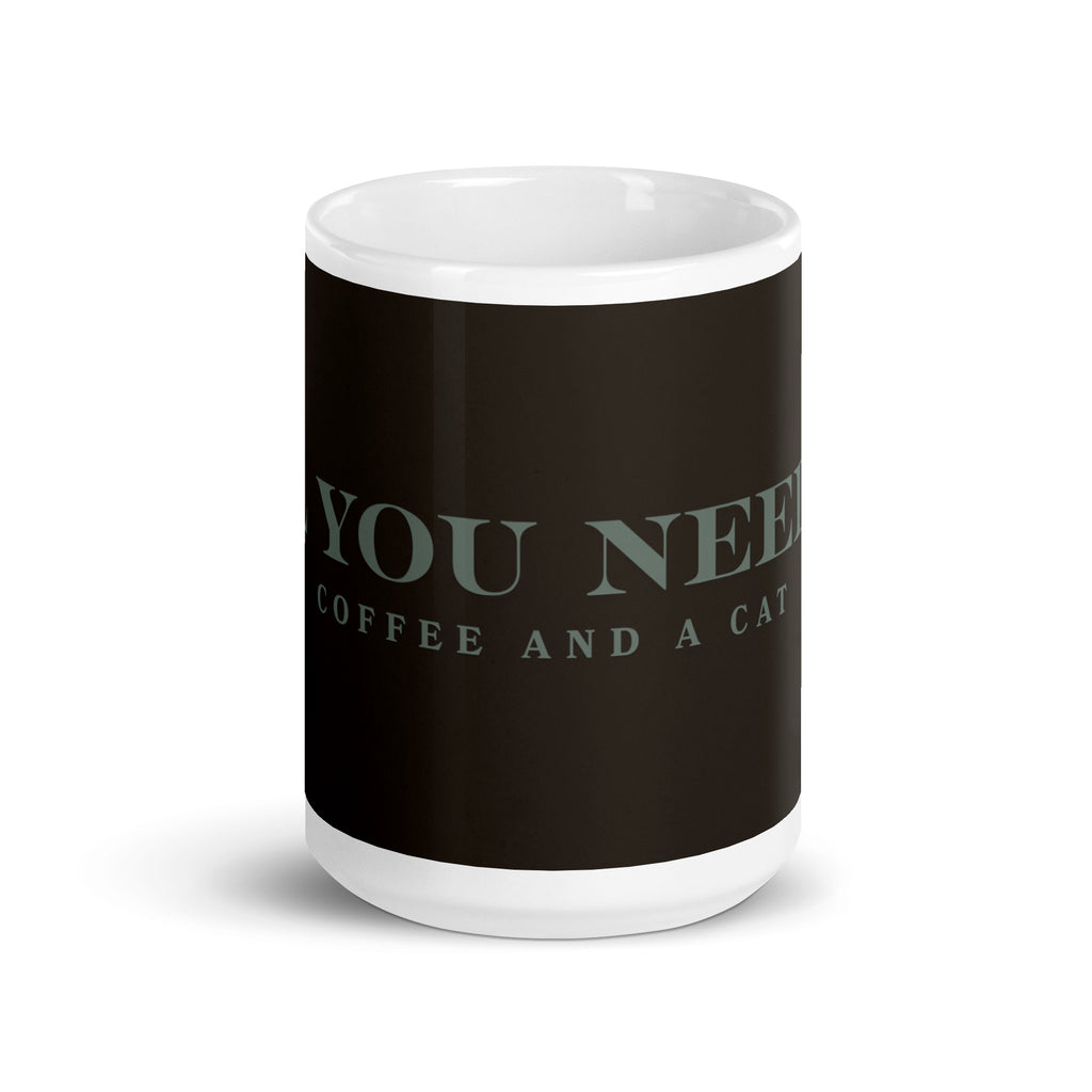 A white glossy mug with the graphic stating, " All You Need is Coffee and A Cat" 