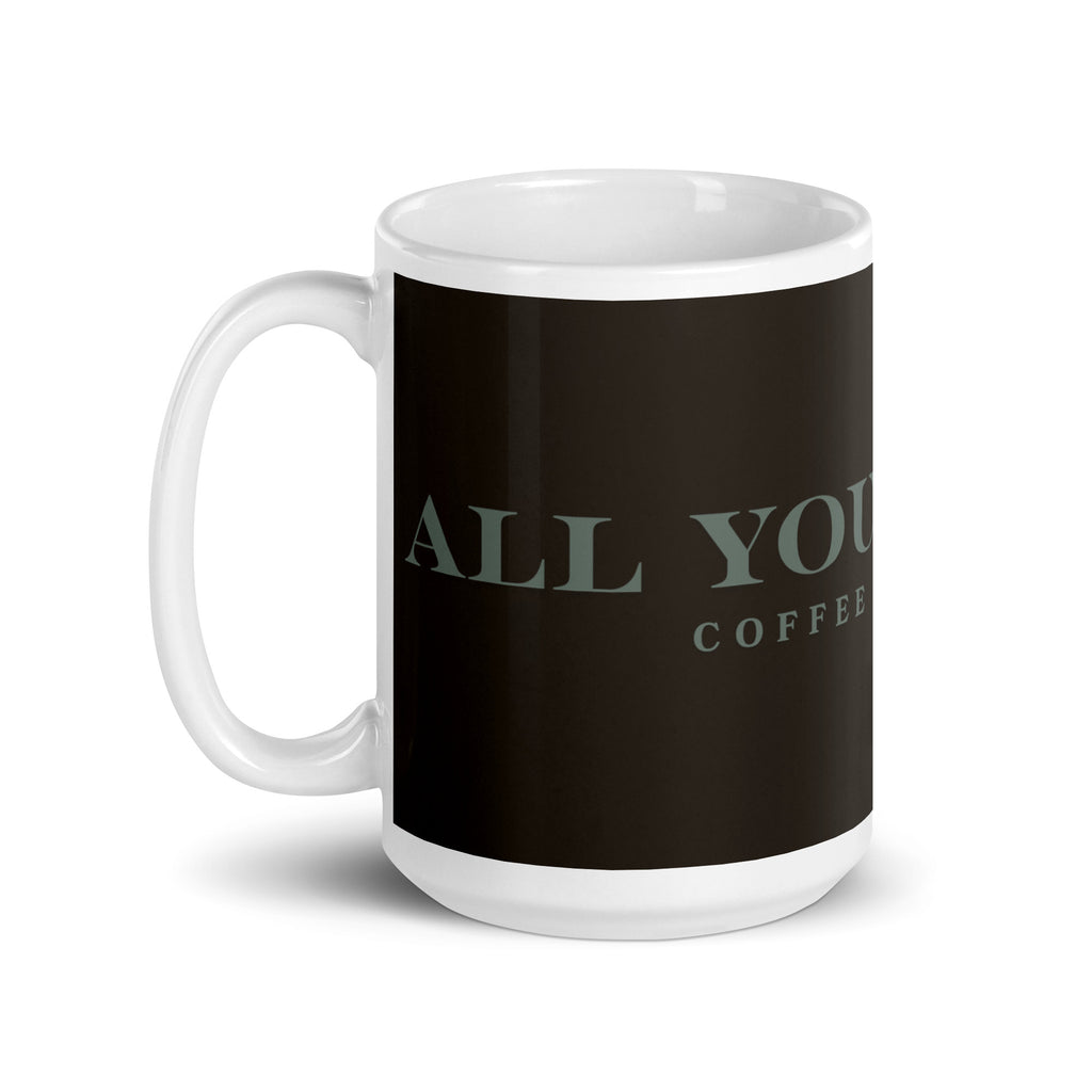 A white glossy mug with the graphic stating, " All You Need is Coffee and A Cat" 