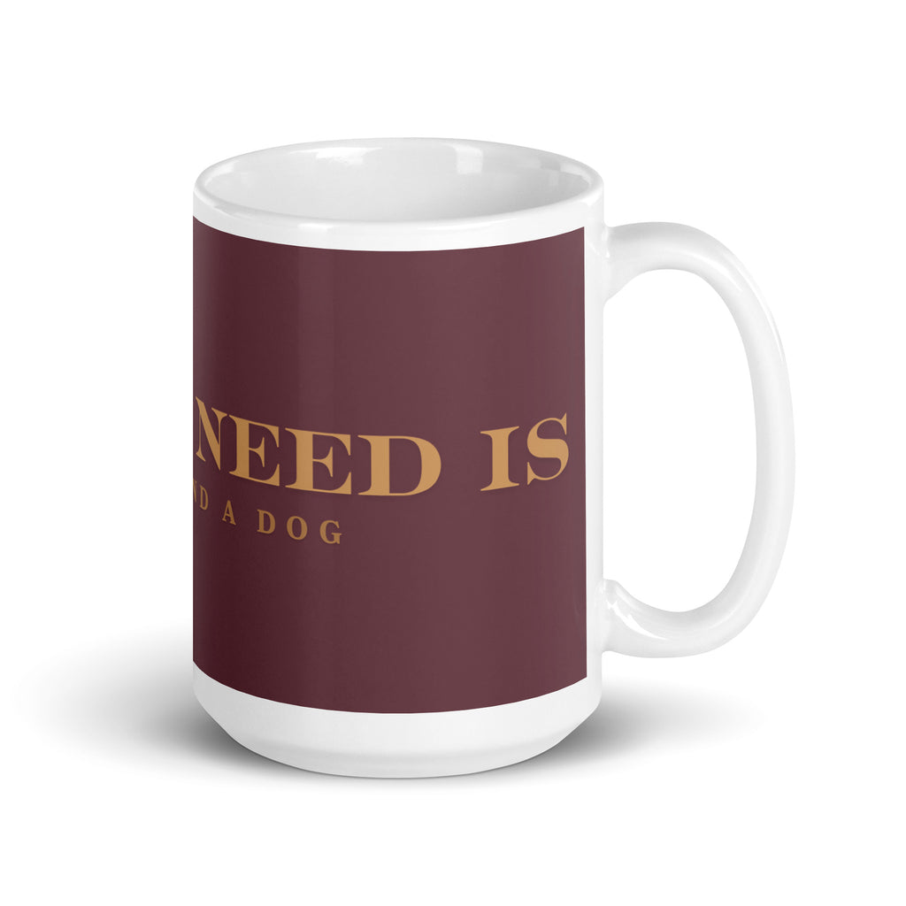 An white glossy mug with the graphic stating, " All You Need is Coffee and A Dog" 