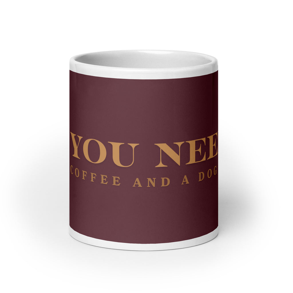 An white glossy mug with the graphic stating, " All You Need is Coffee and A Dog" 