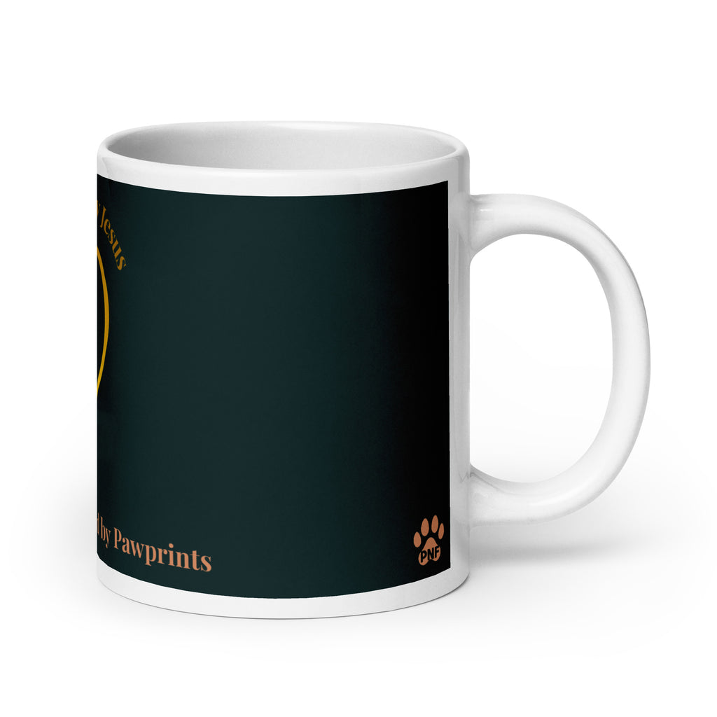 Side view of white glossy mug with a teal background. The graphic is a gold heart with a gold crown on top. The phrase is, " Favored by Jesus, Followed by Paw prints".  Small pet paw prints are walking through the heart graphic. 